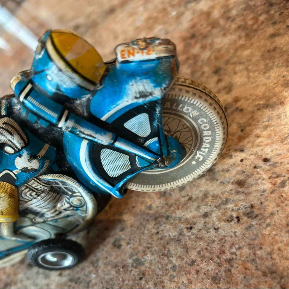 Tin Lithograph Friction Drive Ballon Cordatic toy cycle EN-12-63 Vtg 1950 Era.